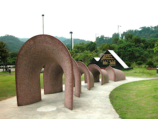 „Tunnel“, red African granite, Children's playground near a motorway exit near Shi Ding, Taiwan.