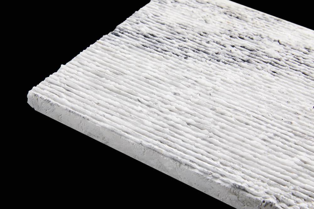 Marble Sparkling White, dark veins, grooved.
