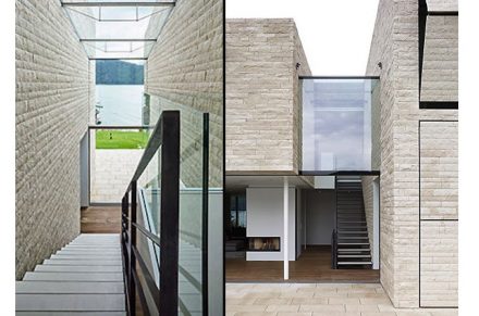 A kind of canyon in the middle of the house accommodates the stairwell and is also clad in stone.