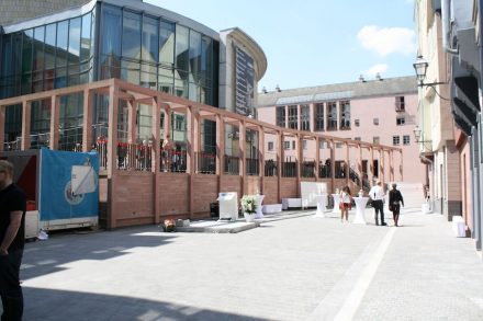 A large awning solved the problem of different street levels and demarks the Coronation Path.