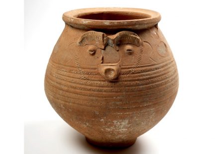 Face pot used as a cremation urn.