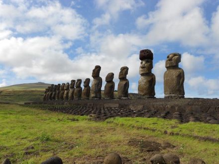 A restored statue platform with standing moai on the south coast of Rapa Nui. Note that one of the moai is adorned with a red scoria pukao. Photo: Sean Hixon