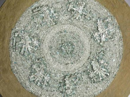 Close up view of Mixteca-style shield decorated with turquoise mosaic from the collections of the Smithsonian Institution-National Museum of the American Indian. Credit: Frances F. Berdan