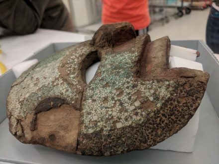 Close up view of Mixteca-style mask decorated with turquoise mosaic from the collections of the Smithsonian Institution-National Museum of the American Indian. Credit: Alyson M. Thibodeau