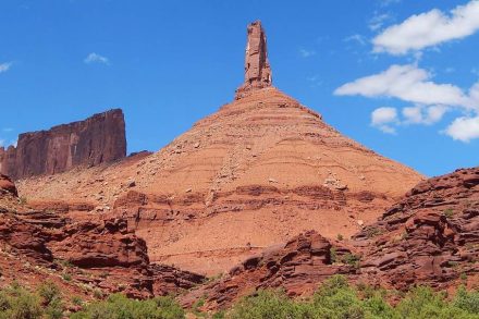Castleton Tower standing over a redrock landscape.
Photo: Ronald J. Scott