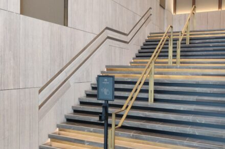 Travertine handrails in the renovated Manhattan Center in Brussels.