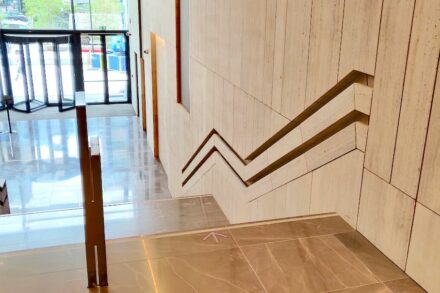 Travertine handrails in the renovated Manhattan Center in Brussels.
