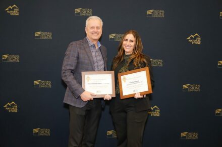 Photo of the ceremony with Kayla Keenan accepting the award and Michael Picco, than NSI president.