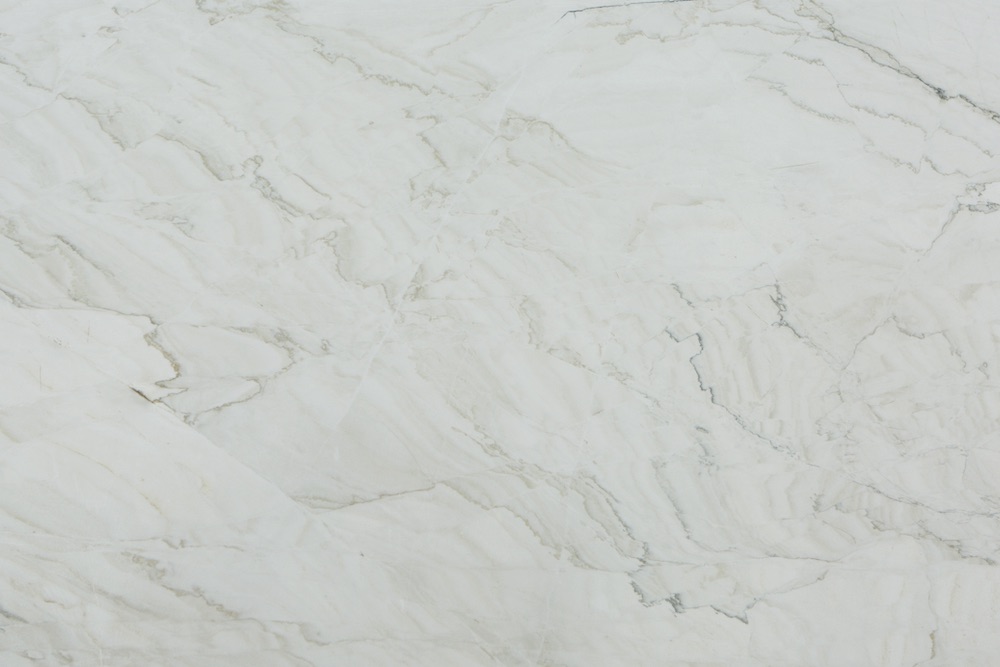CALACATTA LUX, a white Brazilian quartzite with cream and gray veins, from Vitoria Stone company headquartered in Espírito Santo state