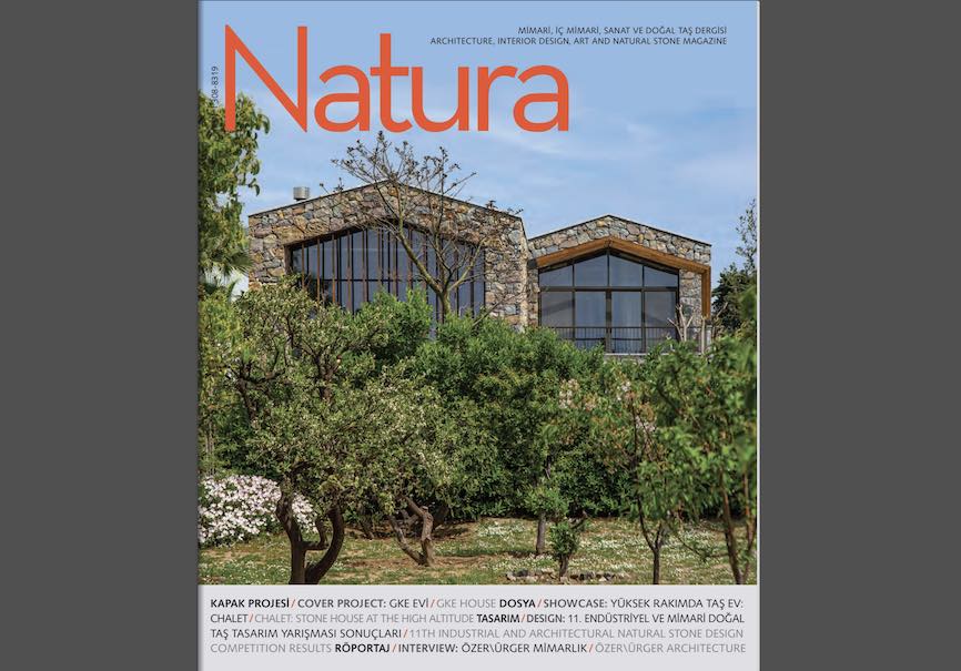 In the GKE House, Turkish architect Ali Can Helvacioglu designs a modern house with a tradional stone shell, as described in IMIB association’s magazine Natura (#64)