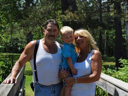 Doug with his wife Heather and the grandson Landon.
