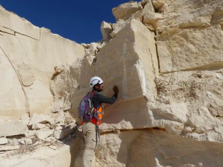 Sedimentologist examining the limestones in a quarry that came into question. Photo: © David Dessandier – BRGM