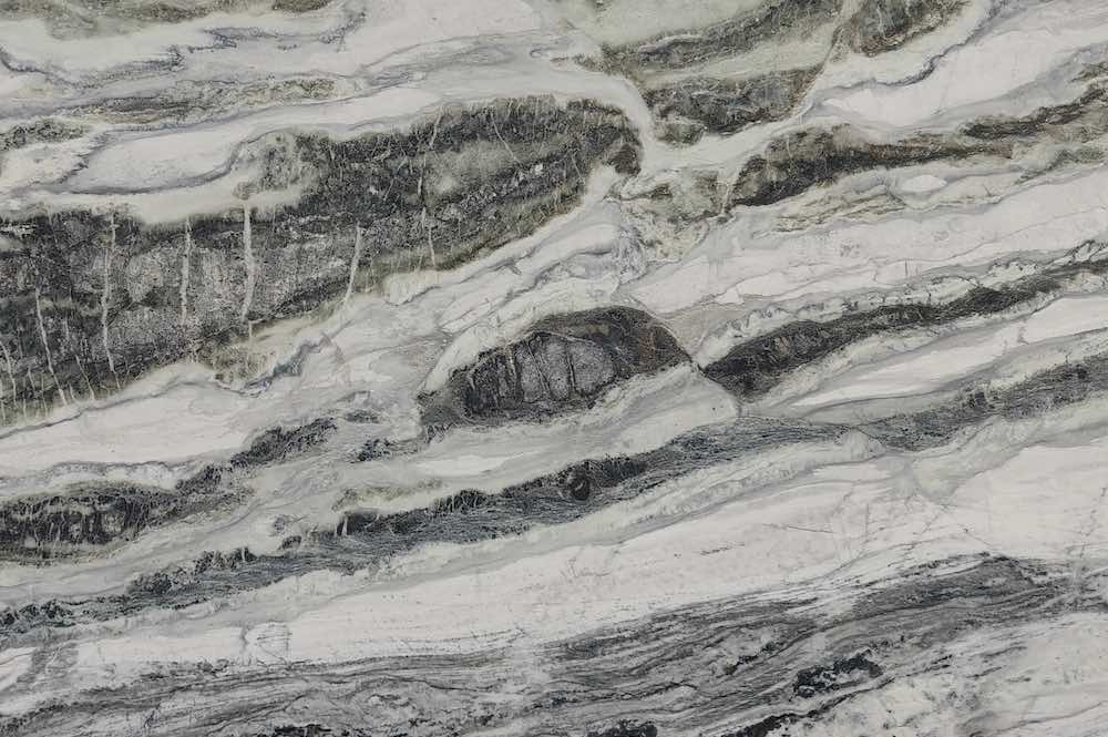 PATEK GREEN quartzite, with green veins on a white background and a very high translucency, quarried by Yanue Import and Export in Liaoning Province, China (with offices in Xiamen and Shuitou)
