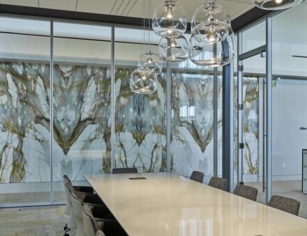 Bank OZK Headquarters, Little Rock, Arkansas: Architect: Polk Stanley Wilcox Architects; Stone Suppliers: Levantina, The Stone Collection, Triton Stone Group; McElroy Tops & Floors Stone Fabricator: McElroy Tops & Floors; Stones used: Calacatta Apuano Extra marble, Calacatta Borghini marble, Calacatta Macchia Vecchia marble, Icarus quartzite, Michelangelo quartzite, Pearl Grey marble, Tempest Blue quartzite, and others.