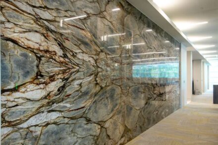 Bank OZK Headquarters, Little Rock, Arkansas: Architect: Polk Stanley Wilcox Architects; Stone Suppliers: Levantina, The Stone Collection, Triton Stone Group; McElroy Tops & Floors Stone Fabricator: McElroy Tops & Floors; Stones used: Calacatta Apuano Extra marble, Calacatta Borghini marble, Calacatta Macchia Vecchia marble, Icarus quartzite, Michelangelo quartzite, Pearl Grey marble, Tempest Blue quartzite, and others.