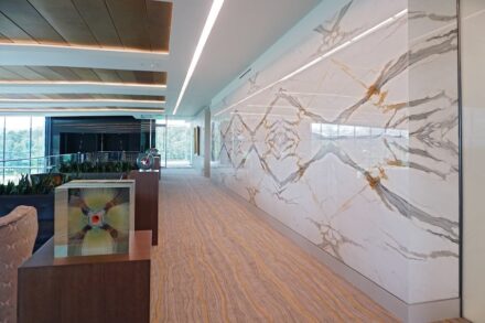 Bank OZK Headquarters, Little Rock, Arkansas: Architect: Polk Stanley Wilcox Architects; Stone Suppliers: Levantina, The Stone Collection, Triton Stone Group; McElroy Tops & Floors Stone Fabricator: McElroy Tops & Floors; Stones used: Calacatta Apuano Extra marble, Calacatta Borghini marble, Calacatta Macchia Vecchia marble, Icarus quartzite, Michelangelo quartzite, Pearl Grey marble, Tempest Blue quartzite, and others. 