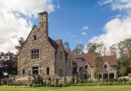 Cotswold-Inspired Residence, Strafford, Pennsylvania. Architect: John Milner Architects; Landscape Architect: Jonathan Alderson Landscape Architects; Stone Suppliers: Media Quarry Company, Vickery Stone Company; Stone Installer: Joseph Manero & Sons; Stones used: Indiana Limestone, Wissahickon mica schist.