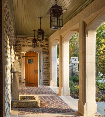 Cotswold-Inspired Residence, Strafford, Pennsylvania. Architect: John Milner Architects; Landscape Architect: Jonathan Alderson Landscape Architects; Stone Suppliers: Media Quarry Company, Vickery Stone Company; Stone Installer: Joseph Manero & Sons; Stones used: Indiana Limestone, Wissahickon mica schist. 