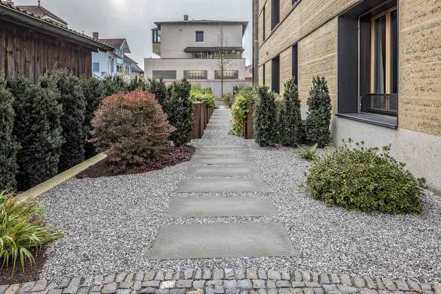 Natural stone characterizes the outdoor areas.