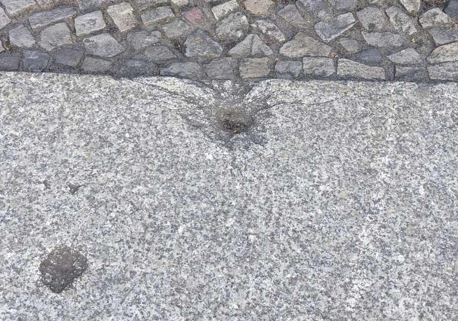A leap back in time between 1943 to 1945: Holes in granite paving stones tell the story of the bombing raids in Berlin and elsewhere