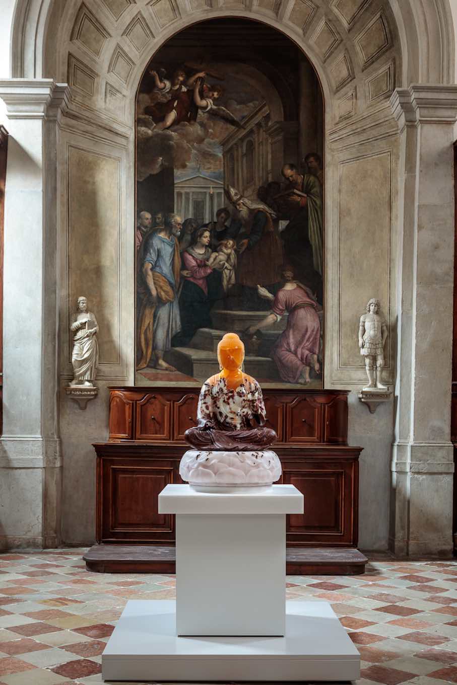 “Buddha, 2018–2025.” Sculpture: Golden Honeycomb calcite, wounded Mexican (Baja) onyx, French Rouge de Roi marble, translucent pink Iranian onyx; pedestal top: white Vietnamese marble; lower pedestal assembly: stainless steel, wood, acrylic lacquer, steel, nylon, plastic.